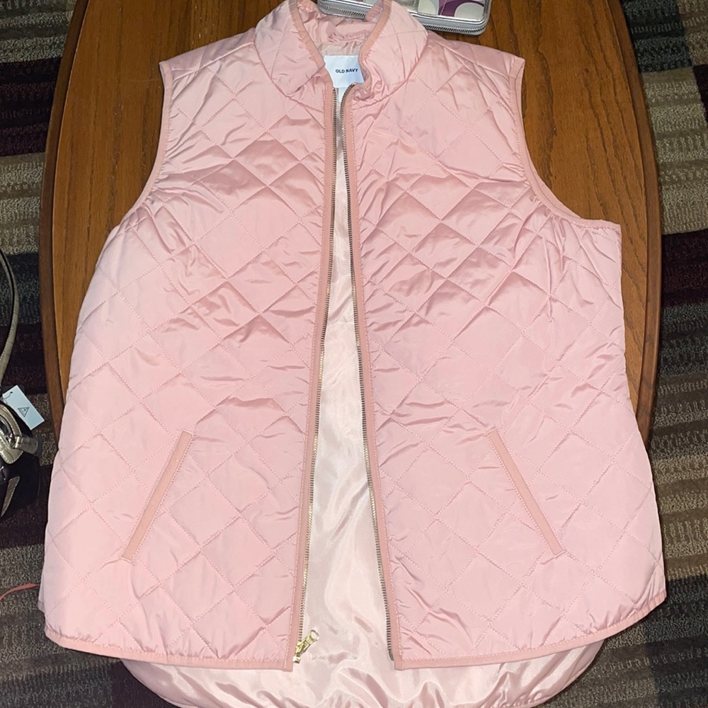 Pink vest.